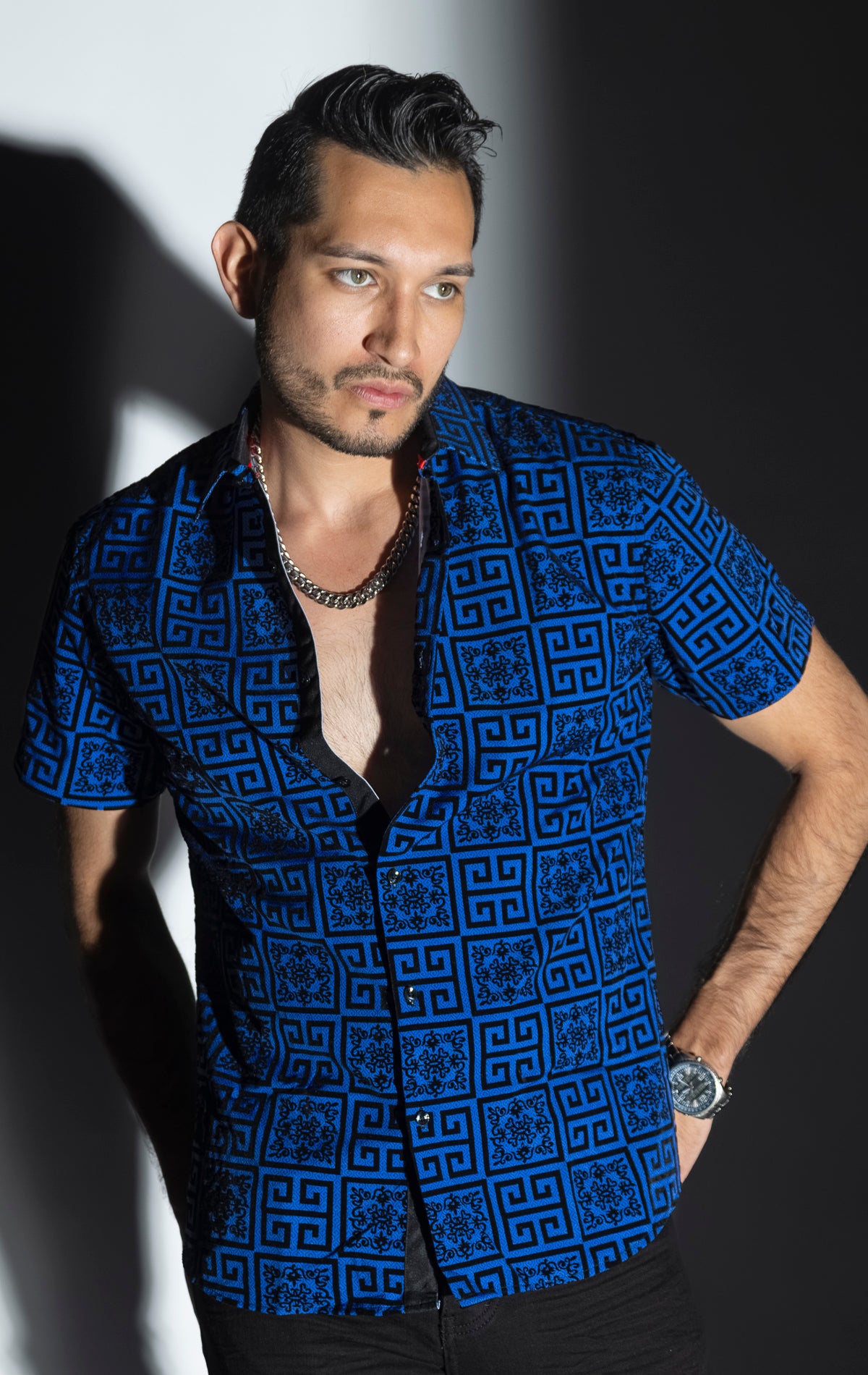 Blue Men's casual, relaxed-fit button-down shirt with a short sleeve design. The shirt features an all-over Greek key pattern and a front button closure.